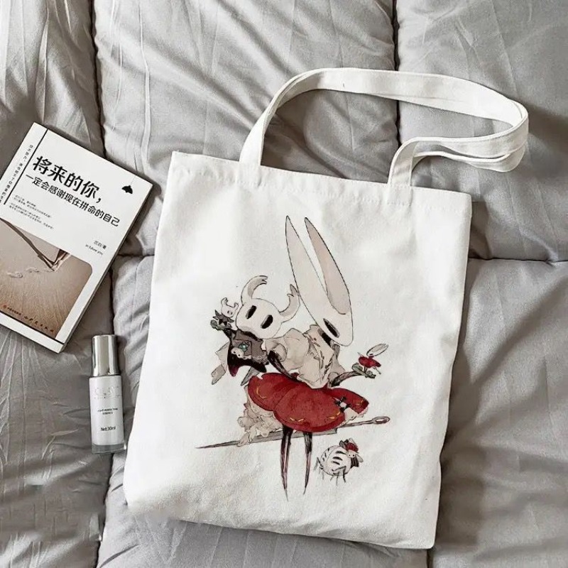 Canvas Tote Bag - กระเป๋าผ้าแคนวาสลายการ์ตูน Hollow Knight สำหรับใส่ของ กระเป๋าสะพายไหล่ กระเป๋าช้อปปิ้งลายการ์ตูน